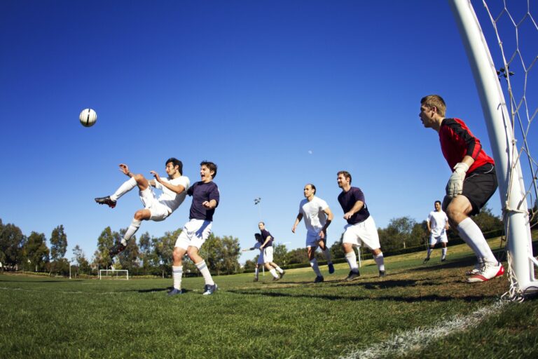 friends-playing-soccer-at-field.jpg