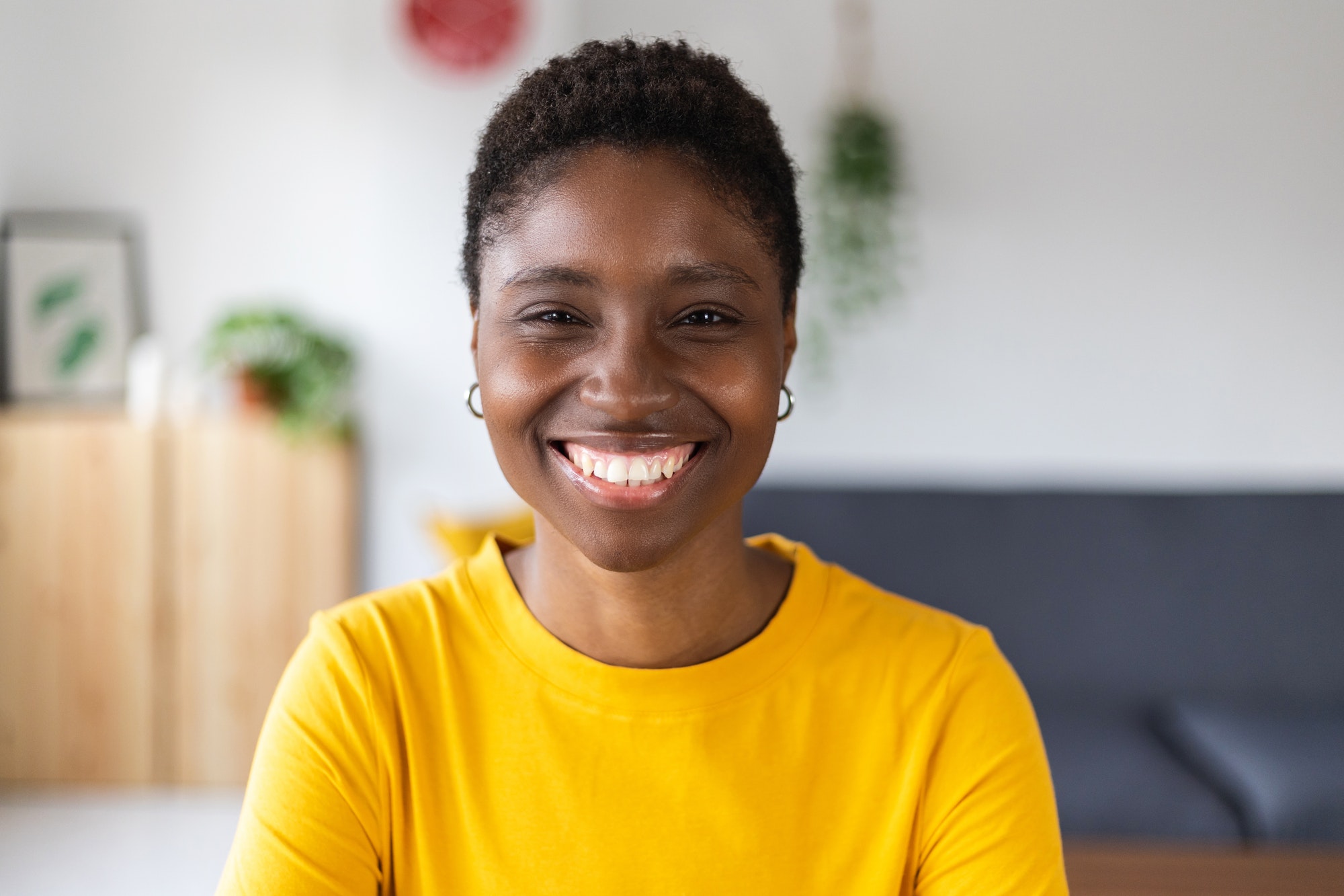 portrait-screen-view-of-smiling-millennial-african-woman-on-video-call-at-home.jpg